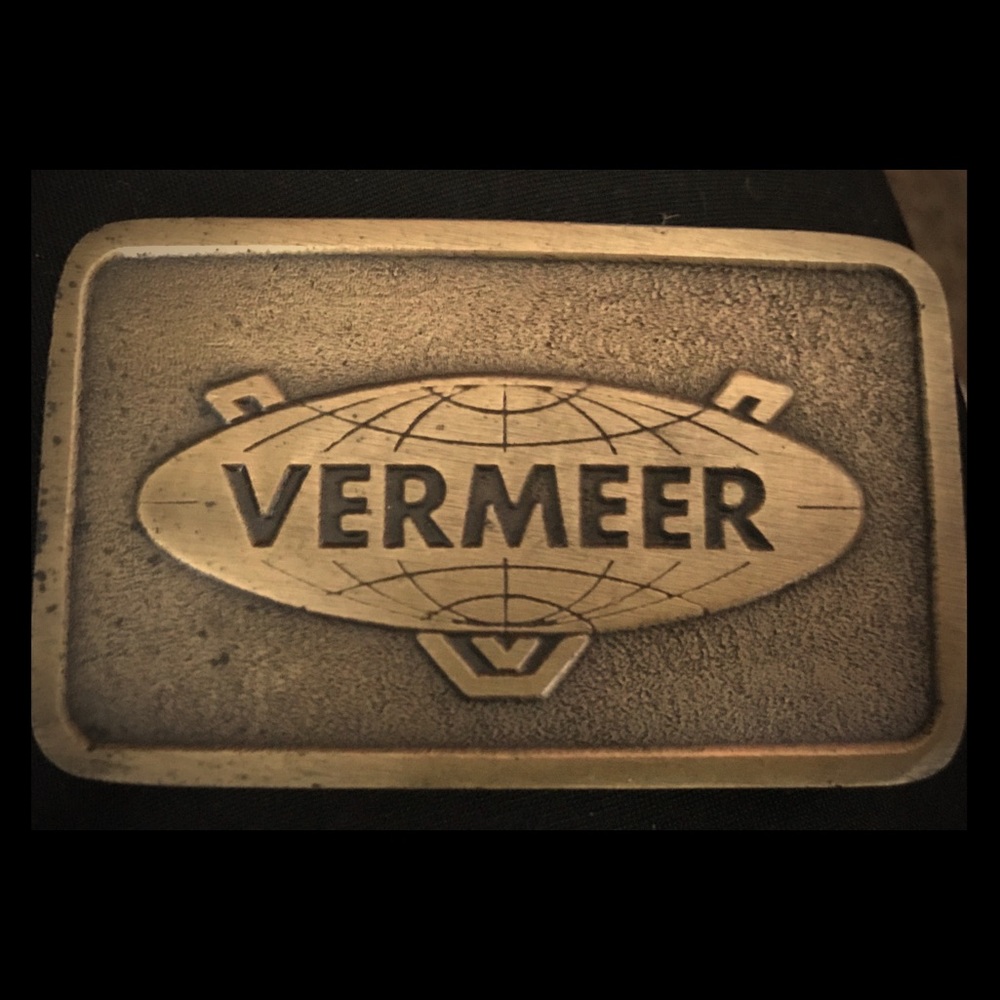 Vermeer brass belt buckle and Vermeer puffy vest